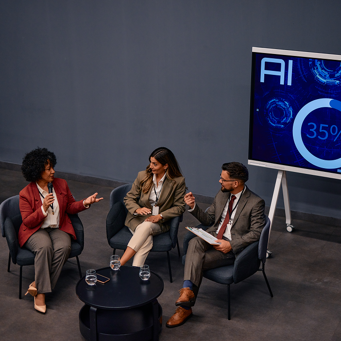 Business professionals discussing AI trends